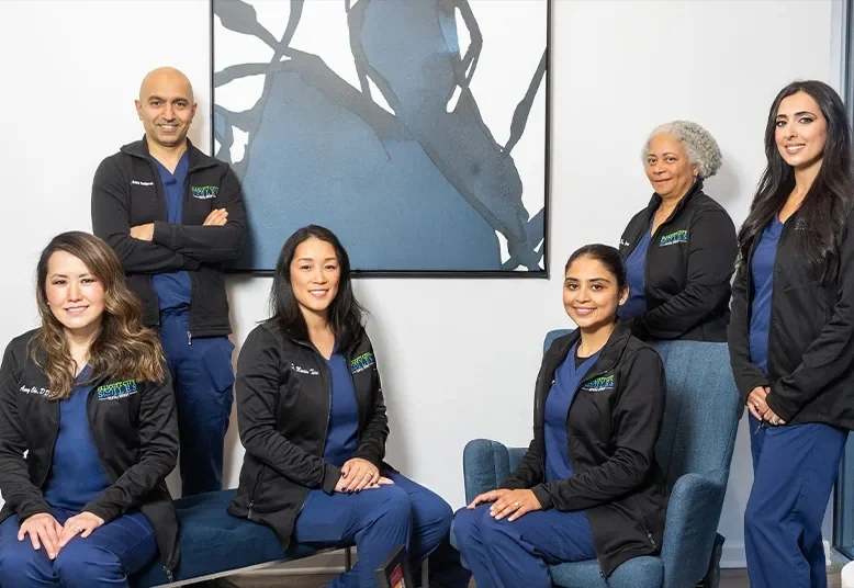 Six of the practice's dentists together in the office: Dr. Cha, Dr. Modarres, Dr. Tiu, Dr. Khatra, Dr. Carrington and Dr. Sabah.