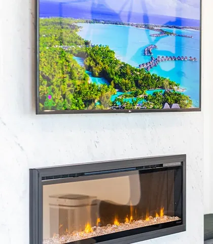 A screen and a fireplace set into the waiting-room wall.